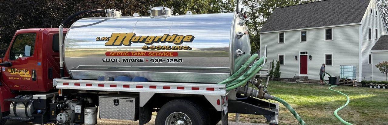 A Morgridge septic pump truck working a scheduled residential visit.