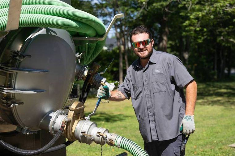 A crew member at the truck valve on a scheduled visit.