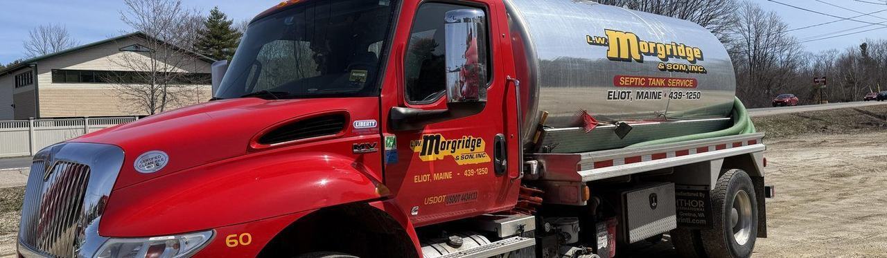 A Morgridge pump truck parked at a house on a routine pumping call.